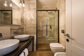 Eco Chic room with sofa bed and kitchen by Design Club Collection